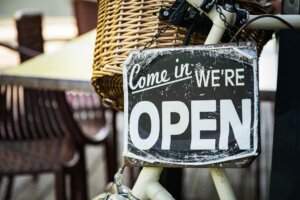 A signboard with "open" of a store (punned)